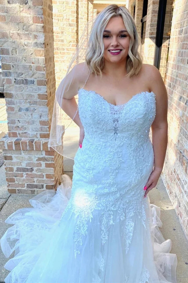 Vestido de novia de cola de trompeta sin tirantes con apliques